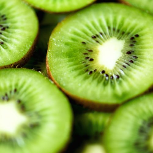Fresh organic kiwi fruit sliced. Food frame with copy space for your text. Banner. Green kiwi